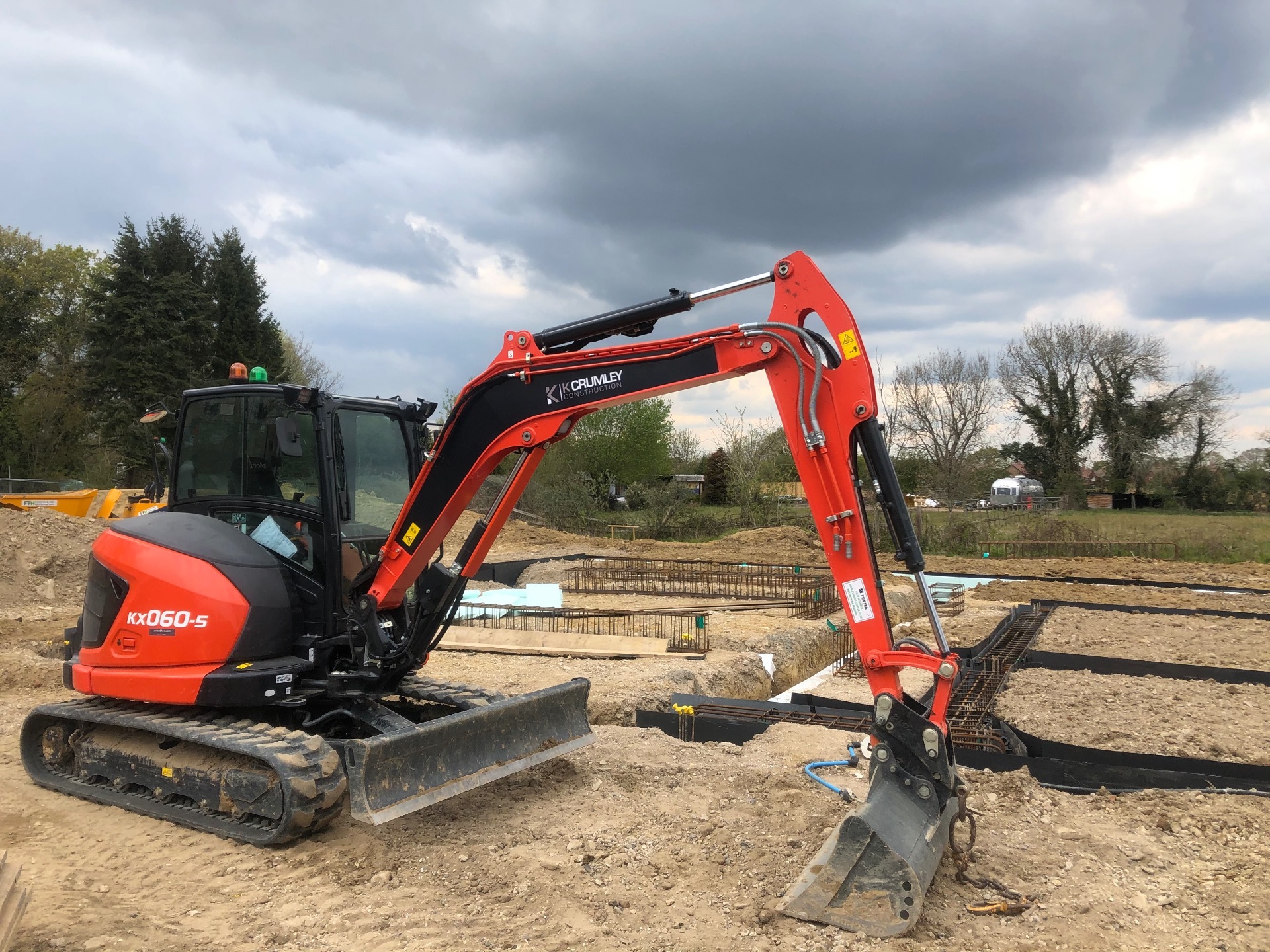 One of K Crumley Construction's diggers hard at work on a groundworks project in west Sussex.