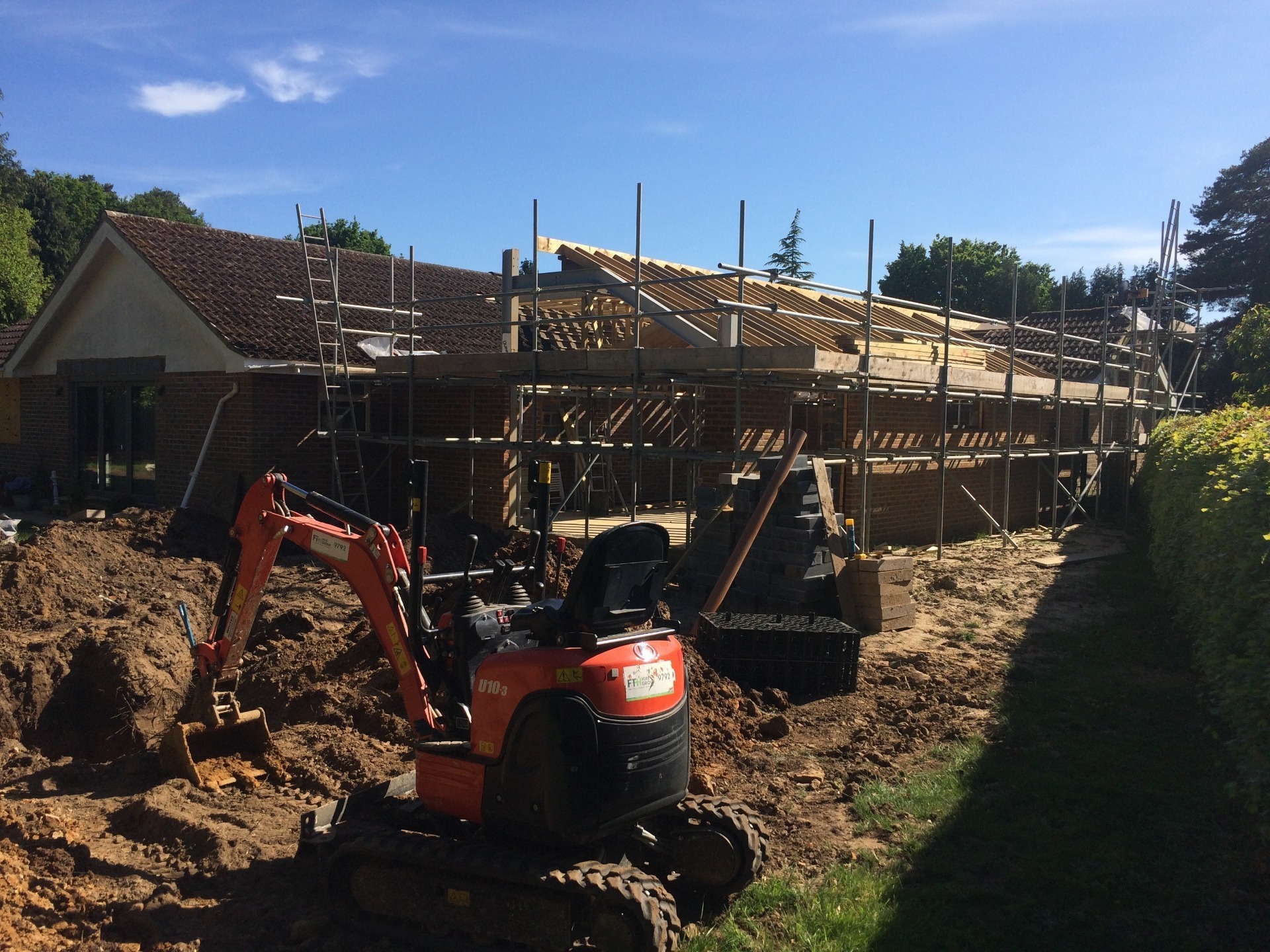 One of K Crumley Construction's diggers hard at work on a groundworks project in west Sussex.