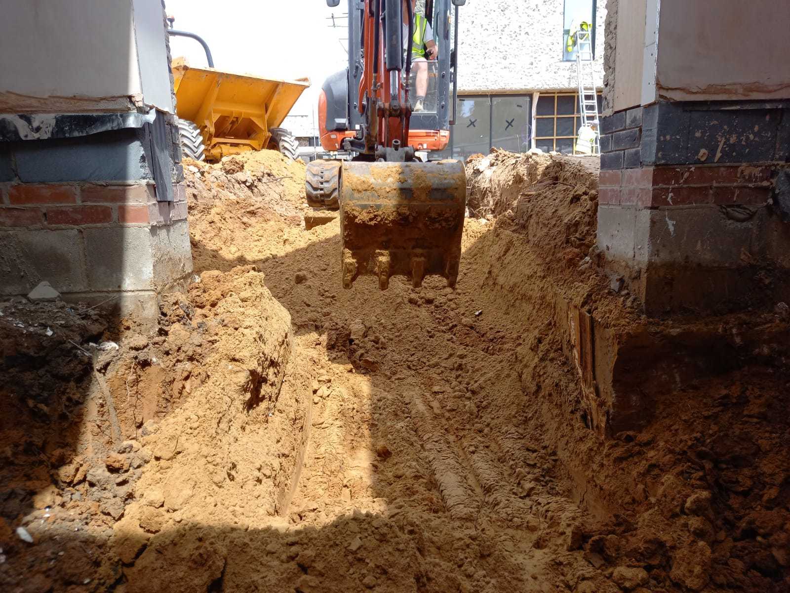 A K Crumley Construction mini digger in action on West Sussex.